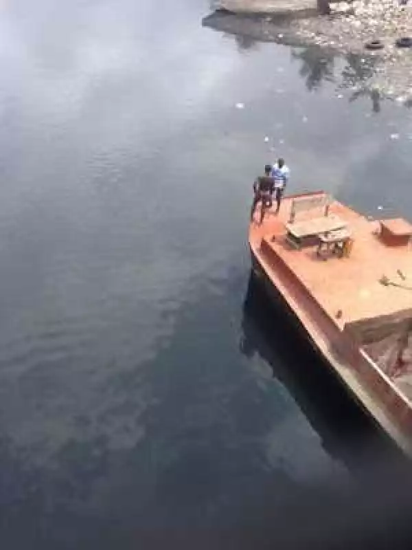 Photos: Man Jumps Into A Canal In Lagos